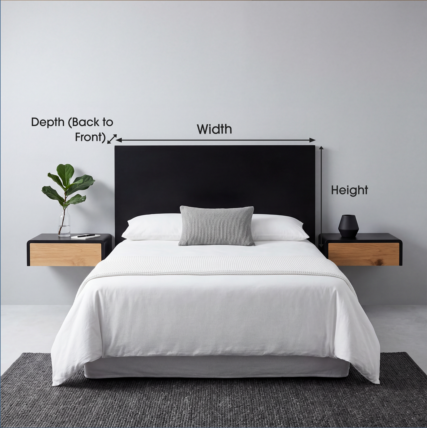A bed with white bedding and a gray pillow in front of a black upholstered headboard, shown in a bedroom setting with floating wood-and-black nightstands, wall labels indicating depth, width, and height, and a plant on one side.